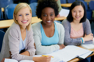 Image showing Education is the key to our futures. Shot of female university students sitting in an exam room.