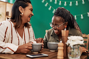 Image showing Life is short. Fill it with love and laughter. Shot of two young women chatting at a cafe.