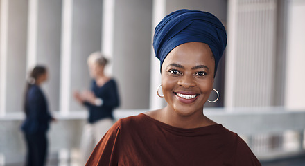 Image showing Confidence keeps you at the front of the business game. Portrait of a confident young businesswoman against a city background.