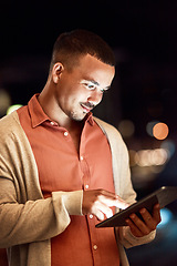 Image showing The internet is full of success stories. Cropped shot of a businessman using a digital tablet while standing outside.