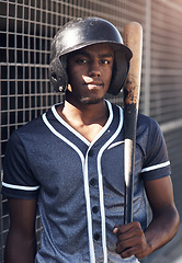 Image showing Quitting is not an option. Shot of a young man holding his bat at a baseball game.