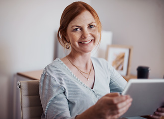 Image showing Were living in such a smart world these days. Portrait of a mature businesswoman using a digital tablet in an office.