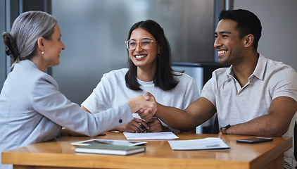 Image showing Smile, couple and handshake with financial consultant for deal, agreement or contract. Happy, man and woman shaking hands of broker for finance, loan or mortgage, welcome and thank you for investment