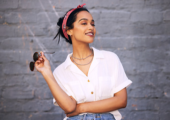 Image showing Fashion, smile and Indian woman with ideas, thinking and confident lady against grey wall with sunglasses. Female person, ideas and happy girl with eyewear, casual outfit or streetwear with happiness