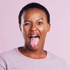 Image showing Woman, eye and tongue in pink studio background with emoji in africa with closeup. Female person, face and meme with funny expression with eyes and open mouth for comedy, joy and goofy girl in youth.