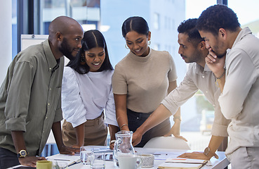 Image showing Business people, team and discussion of paperwork at table in office for planning project, collaboration and ideas in startup. Group, diversity and employees meeting for brainstorming with documents