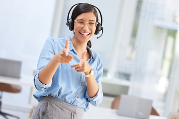 Image showing Portrait, call center or woman with gun fingers, telemarketing or excited with promotion. Face, female person or employee with hand gesture, shooting or agent with a smile, tech support or headphones