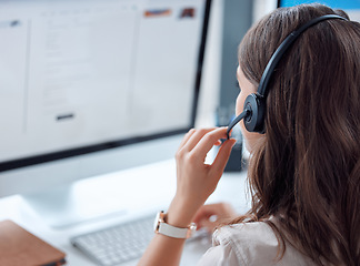 Image showing Customer support, call center and back of female agent working on online consultation in the office. Telemarketing, communication and saleswoman planning crm with headset and computer in workplace.