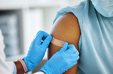 Image showing Healthcare, doctor with plaster on a patient arm and in a hospital room. Medicine treatment or safety care, surgeon with scrubs and nurse with medical aid kit with a person at a clinic for wellness