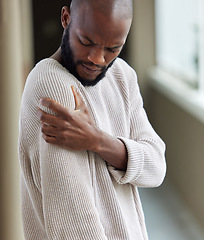 Image showing Shoulder, pain and black man with injury, home and muscle tension with strain, health issue or emergency. Male person, accident or guy with medical problem, inflammation or joint with body tendinitis