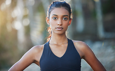 Image showing Portrait, outdoor and woman with fitness, exercise and workout goal with wellness, health and progress. Face, female person and athlete outside, forest and training with sports, serious and endurance