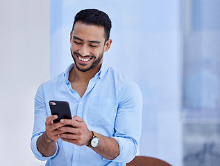 Image showing Happy asian man, phone and smile for communication, social media or chatting at the office. Businessman smiling and typing on mobile smartphone app for texting, online chat or networking at workplace