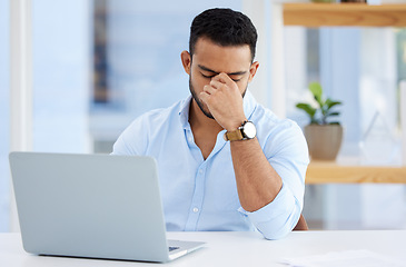 Image showing Mental health, businessman with headache and laptop at desk at his workplace. Anxiety or depression, mistake and stress or frustrated male person sitting at table at his modern office at work