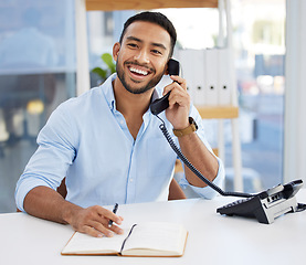 Image showing Consultant, businessman writing in a notebook and on a phone at his desk at work. Customer support or service, contact and smiling male person using telephone with writing book at his workplace