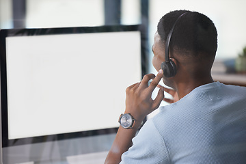 Image showing Call center, man and computer screen or mockup for customer service, support and crm website. Back of a male person, consultant or agent with a headset for help, sales and telemarketing with internet