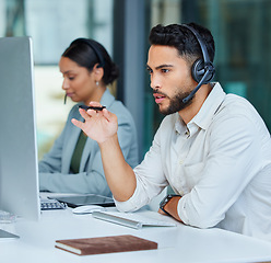 Image showing Business man, call center pc and web support communication at a computer in a office. Phone conversation, desk and male worker with contact us, crm and customer service job in a consulting agency