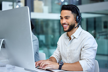 Image showing Business man, call center and web support communication at a computer in a office. Phone conversation, smile and male worker with contact us, crm and customer service job in a consulting agency