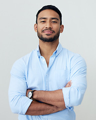 Image showing Accountant, portrait and business man with arms crossed in studio isolated on white background. Face, confidence and Asian male professional, entrepreneur or auditor from Singapore with career pride.