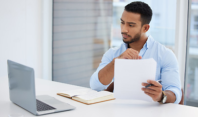 Image showing Paperwork, laptop and business man analyst working on project in office workplace. Computer, documents and serious male professional analyze report for finance, planning strategy and reading email.