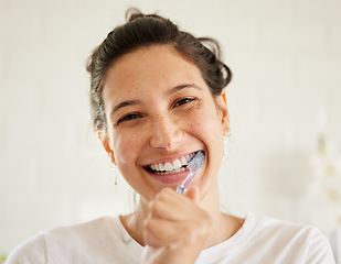 Image showing Healthcare, portrait of a woman brush her teeth and smile in her bathroom of her home. Hygiene or self care, health wellness or dental treatment and female person with brushing mouth with toothbrush