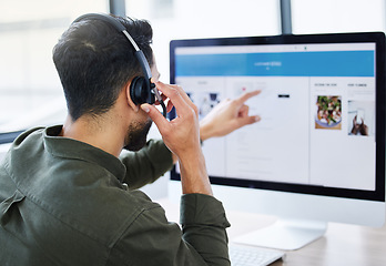 Image showing Call center, Customer support and man telemarketing consultant working on a computer screen for advice in SEO. Help, agency and worker consulting in a online fast food company, service or app