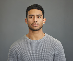 Image showing Serious man, casual style and portrait with modern fashion in a studio. Male model, grey background and young person from Philippines of a handsome Asian adult with confidence, attitude and jersey