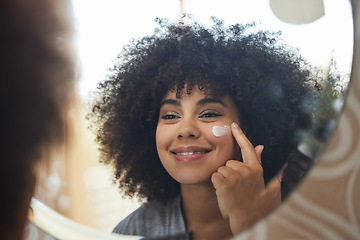 Image showing Beauty, cream and skincare with woman in mirror for product, facial and cosmetics. Morning routine, reflection and self care with face of female person and lotion at home for sunscreen and glow