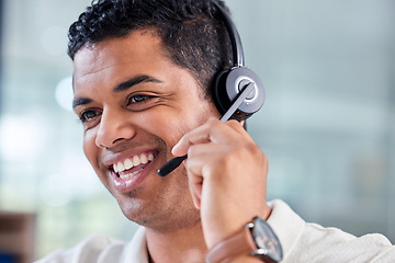 Image showing Happy, smile and male customer service consultant working on an online consultation in the office. Confidence, contact us and man call center or telemarketing agent with headset for crm communication