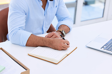 Image showing Business man, hands and writing in notebook at desk for planning summary, company report and review with laptop. Closeup, employee and notes for agenda, schedule and planner for information in office