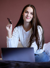 Image showing Portrait, woman and credit card with laptop and online banking for ecommerce purchase on app. Tech, bedroom and female person with student budget planning and internet payment at home with smile