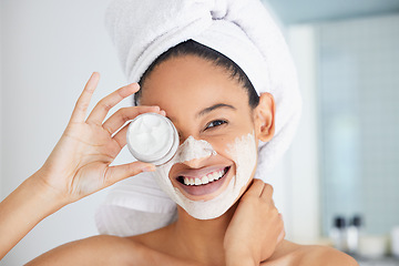 Image showing Portrait, happy woman and towel with mask, jar and skincare product in bathroom for face, cosmetics and self care. Clean shower, beauty and female person with container, facial cream and dermatology