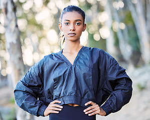 Image showing Fitness, nature or portrait of girl runner in training, exercise or workout with resilience or wellness. Face, motivation or healthy sports woman on exercising or running break in forest or woods