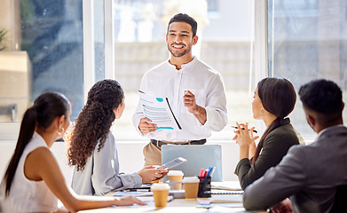 Image showing Staff, presentation and business man in a meeting, teamwork and planning with brainstorming, feedback and review. Presenter, group and team share ideas, collaboration and partnership with documents