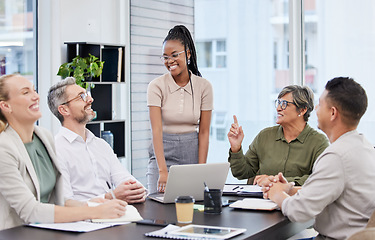 Image showing Business meeting, laughing and people with manager, african woman or presenter for company planning. Happy person talking to clients in conference room, project ideas and funny discussion on laptop