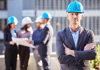 Image showing Businessman, portrait and architect with arms crossed in project management, leadership or construction on site. Confident man, engineer or manager with hard hat and team for industrial architecture