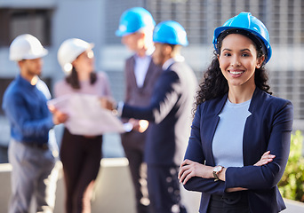 Image showing Happy woman, portrait and architect in construction, leadership or team management with arms crossed on site. Confident female person, engineer or manager with hard hat for industrial architecture