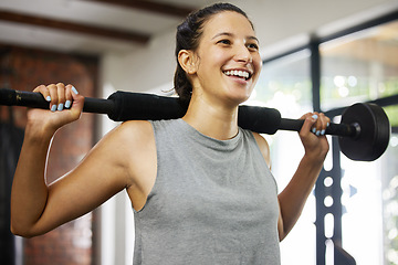 Image showing Fitness, exercise and woman in gym with barbell for workout, training and challenge to be fit, strong and healthy. Girl, bodybuilding and fit athlete building muscle or power in sports, club or class