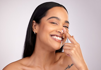 Image showing Happy woman, portrait smile and cream on nose for skincare cosmetics against a grey studio background. Face of female person smiling with beauty lotion, SPF or moisturizing creme for facial treatment