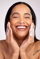 Image showing Happy woman, portrait and soap in face wash for skincare hygiene, cleaning or dermatology against a grey studio background. Female person with smile for clean facial treatment, self care or love