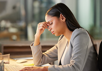 Image showing Headache, stress and business woman in night office for burnout, fatigue or mental health problem. Breathing, pain and sad or depressed professional person at her desk for mistake, depression or fail