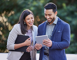 Image showing Business people, team laughing and tablet outdoor with internet connection for social media. A happy man and woman together in a city with tech for networking, funny communication or online meme app