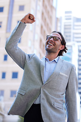 Image showing Success, happy businessman and in the city background walking. Good news or happiness, celebration or achievement and excited or cheerful man walk in urban streets smiling for health wellness