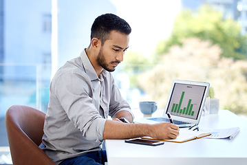 Image showing Young business man, writing and notebook with chart, financial planning and data analysis in modern office. Businessman, book and notes with laptop, graph and analytics for investing in workplace