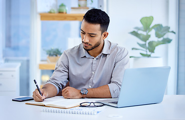 Image showing Young business man, writing and book with laptop, notes or schedule planning at web design job. Businessman, notebook and computer with ideas, brainstorming or problem solving for report in workplace