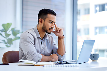 Image showing Technology, businessman with laptop and at his desk in office at workplace with a lens flare. Connectivity or social networking, online and male person reading an email or report at his workspace