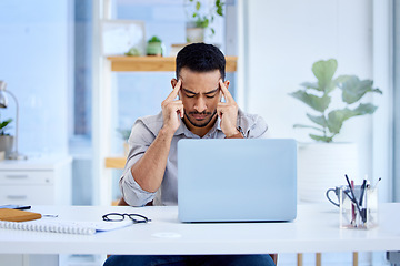 Image showing Mental health, businessman with a headache and laptop on his desk in office at workplace. Anxiety or depression, mistake or problem and male person frustrated or stress sitting at his workstation