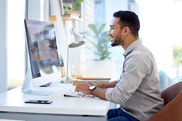 Image showing Technology, businessman with computer and typing on keyboard at a desk in office at his workplace smiling with a lens flare. Networking, connectivity and male person with pc at his workstation