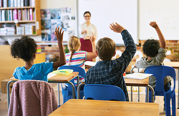 Image showing Education, question with group of children in classroom and raise their hands to answer. Learning or support, diversity and teacher teaching with young students in class of school building together