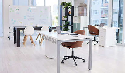 Image showing Presentation, workspace and conference room with table and whiteboard, interior of business office of company. Still life, meeting space for innovation and ideas with furniture in professional setup