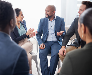 Image showing Business people, meeting and discussion in circle at office for team building, planning and brainstorming collaboration. Group, diversity and employees in a huddle for talking, workshop and training